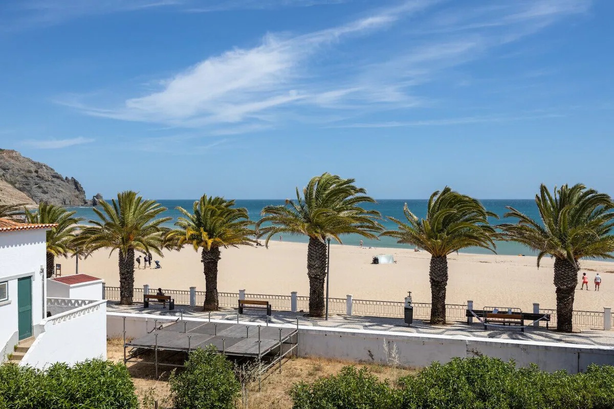 View from the villa balcony over palm trees and the Atlantic